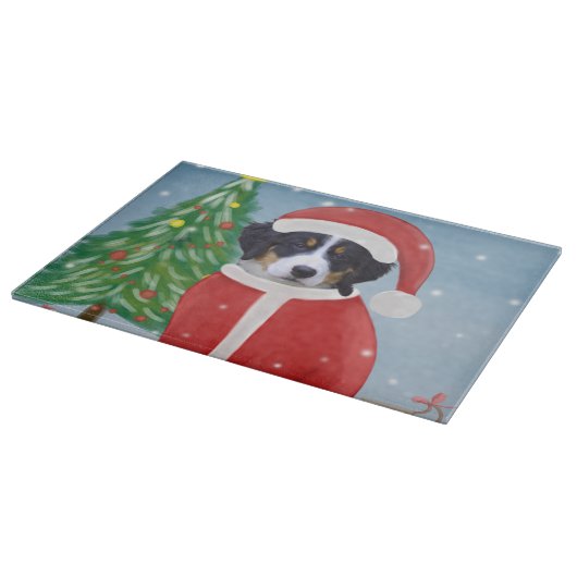 Bernese Mountain Dog in sneeuw met kerstcadeaus Snijplank (Hoek)