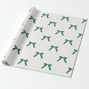 besgroene linten strikken op roomkleurig kerstfees cadeaupapier