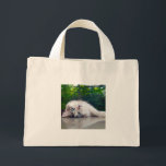 Best cross-eyed cat mini tote bag<br><div class="desc">“The world always looks just a bit out of focus … but I like it that way.”</div>