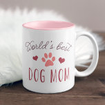 Best Dog Mam ter wereld Tweekleurige Koffiemok<br><div class="desc">We zijn bij je: baby's tellen helemaal als kinderen. Viel de toegewijde hondenmammie in je leven op met deze schattige mok met 's werelds beste hond moeder' in moderne typografie met een roze kleerkunst en een afbeelding van een roze koraalroze poot.</div>