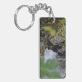 Betoveringen van de aarde sleutelhanger (Voorkant Links)