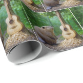 Bever bewondert zijn gesneden gitaarkunst aan een cadeaupapier (Rol Hoek)