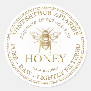 Bewerkbaar wit honingpotlabel met gouden bij ronde sticker