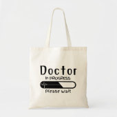 Bezig met de arts Een ogenblik geduld Tote Bag (Voorkant)