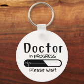 Bezig met het uitvoeren van de behandeling Wacht Sleutelhanger (Voorkant)