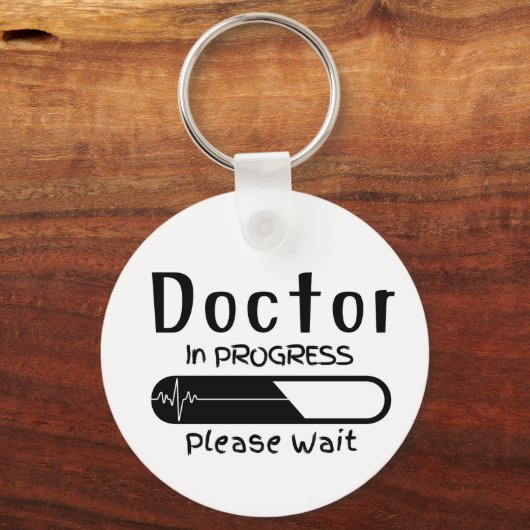 Bezig met het uitvoeren van de behandeling Wacht Sleutelhanger (Voorkant)