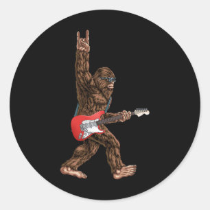 Bigfoot die een elektrische gitaarsteen speelt op ronde sticker