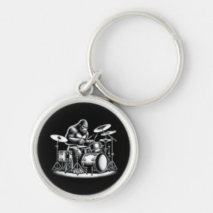 Bigfoot drummer Sasquatch speelt drums muzikant B Sleutelhanger