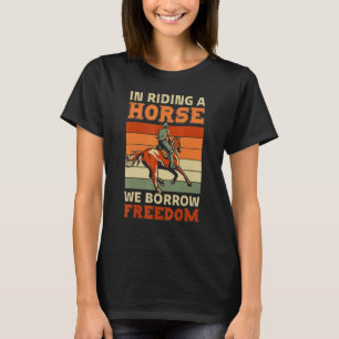 Bij het rijden op een paard lenen we vrijheid Spor T-shirt