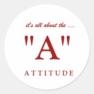 Bij IT T U D E, "A", draait het allemaal om... Ronde Sticker