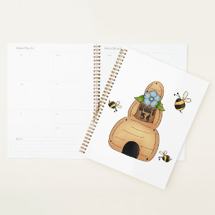 Bijenkorf met blauwe bloem en bijen planner