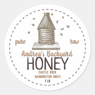 bijenkorf met kleine bijen ronde sticker