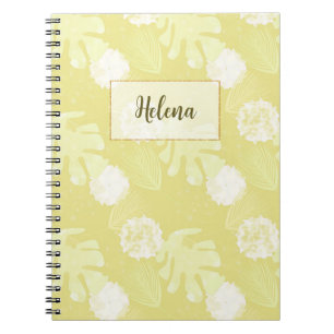 Bijlen, bladeren en bloemen van melkbeige kleur. notitieboek
