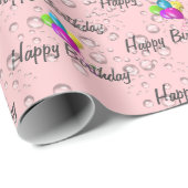 Birthday-regendruppels en ballonnen op roze cadeaupapier (Rol Hoek)