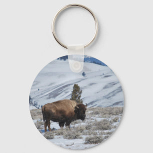 Bison in de winterbergen van geelsteen sleutelhanger