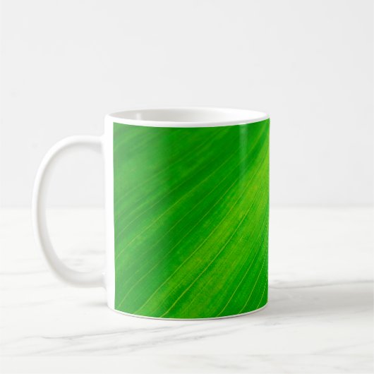 Blaasmazen met groene bladeren koffiemok (Links)