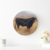 Black Angus Steer Grazing met zijn herd Grote Klok (Huis)