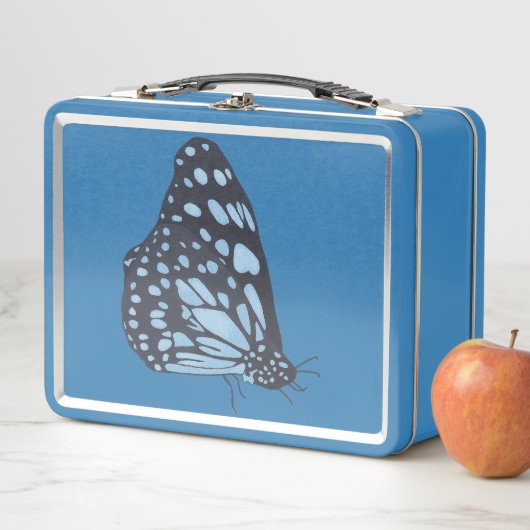 Black butterfly with blue spots, metal lunch boxes (In situ)
