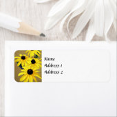 Black-Eyed Susans in een rij Etiket (Insitu)