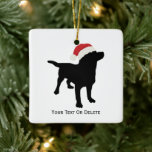 Black Lab Hond met Santa Christmas-Pet Keramisch Ornament<br><div class="desc">Schattigee zwarte labohond met een kerstmis Pet ontwerp - ideaal voor labrador retriever en hondenliefhebbers - gegarandeerd een glimlach op hun gezicht. Personaliseer met uw aangepaste tekst - naam, kerstgroeten of verwijder gewoon de tekst. Bekijk ook onze andere black lab en hondenontwerpen - klik op de Colorfulgalshop logo hieronder en...</div>