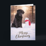Black Labrador Christmas Snowman Card Feestdagen Kaart<br><div class="desc">A heartwarming Christmas card featuring a loyal Black Labrador sitting in fresh winter snow beside a cheerful little snowman wrapped in a red scarf. Warm golden winter light and softly falling snow create a peaceful holiday moment that captures the gentle spirit and faithful companionship Labrador Retrievers are known for. Perfect...</div>
