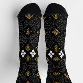 Black socks featuring a gold and white pattern  sokken