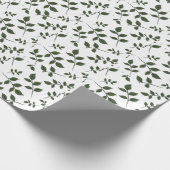 Bladertakken met groene bladeren op wit cadeaupapier (Hoek)