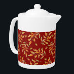 Bladkleuren en herfstkleuren theepot<br><div class="desc">Stijlvolle theepot bevat waterverf illustraties van herfstgekleurde bladeren en eikels op donkerrode achtergrond</div>