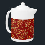 Bladkleuren en herfstkleuren theepot<br><div class="desc">Stijlvolle theepot bevat waterverf illustraties van herfstgekleurde bladeren en eikels op donkerrode achtergrond</div>