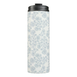 Blauw bloemmotief vintage inpakpapier met botanisc thermosbeker