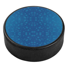 Blauw cirkelvormig product met een stippenpatroon hockey puck