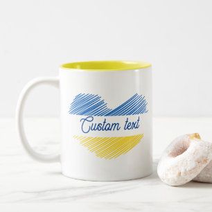 Blauw en geel hart. Eigen Tekst. Tweekleurige Koffiemok