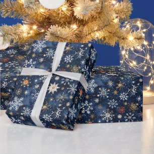 Blauw en goud sneeuwvlok patroon met sterren cadeaupapier