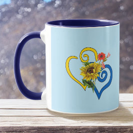 Blauw geel verdraaid hart met zonnebloem op blauw mok