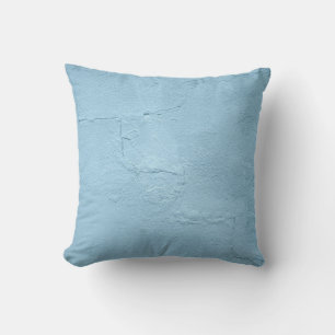 Blauw geschilderde betonwand overdag kussen