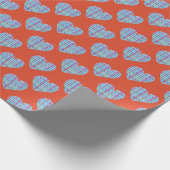 Blauw hartenpatroon op rood cadeaupapier (Hoek)
