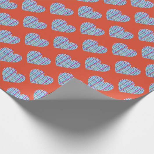 Blauw hartenpatroon op rood cadeaupapier (Hoek)
