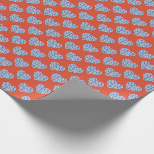 Blauw hartjes patroon op rood cadeaupapier (Hoek)