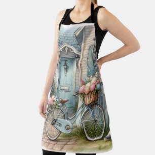 Blauw huisfiets met mand met lentebloemen schort