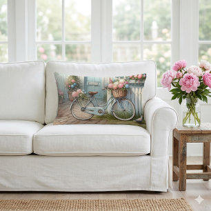 Blauw huisje fiets met mand met lente bloemen kussen