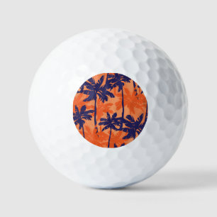Blauw palmsilhouet, oranje achtergrond golfballen