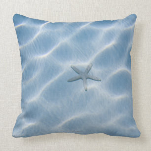 Blauw rimpelwater met zeester kussen