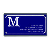 blauw straatnaambord met monogram etiket (Voorkant)