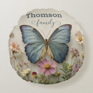 Blauw vlindermotief met bloementuin Familienaam Rond Kussen