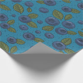 Blauwe bessen op blauw cadeaupapier (Hoek)