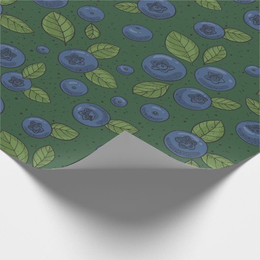 Blauwe bessen op donkergroen cadeaupapier (Hoek)