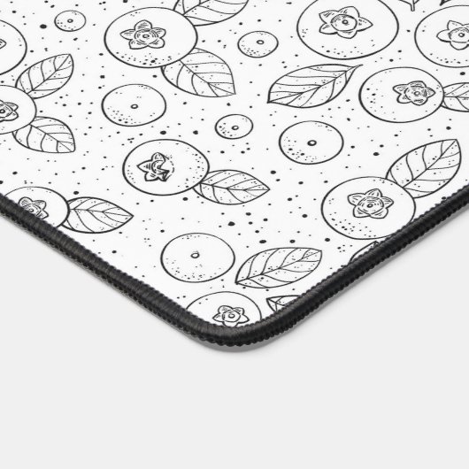 Blauwe bessen op zwart en wit bureaumat (Hoek)