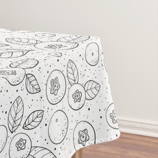 Blauwe bessen op zwart en wit tafelkleed (Voorbeeld)