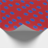 Blauwe bloem op rood cadeaupapier (Hoek)