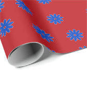 Blauwe bloem op rood cadeaupapier (Rol Hoek)